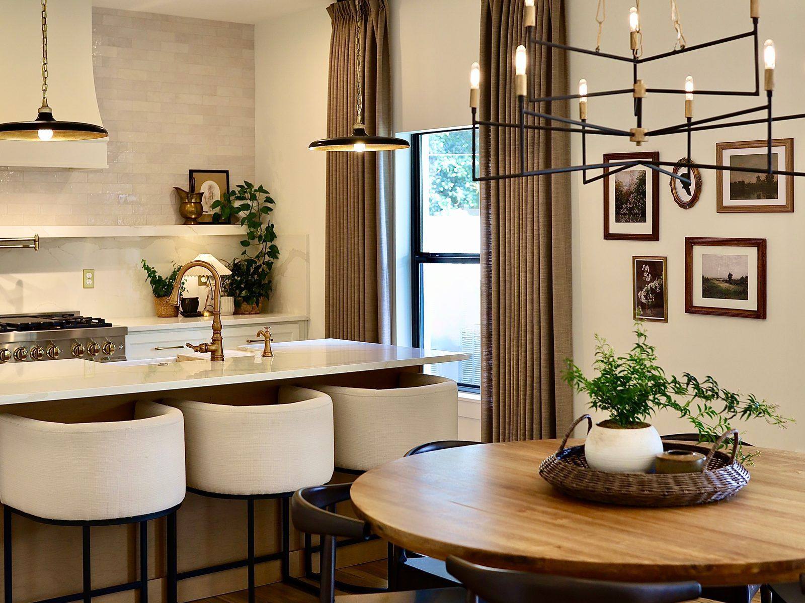 Kitchen island and dining with gallery wall