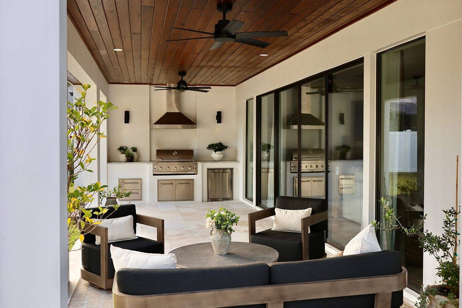 Covered outdoor living room and kitchen